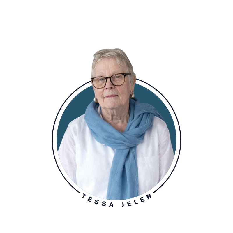 Portrait of Tessa Jelen wearing glasses, a white top, and a blue scarf.